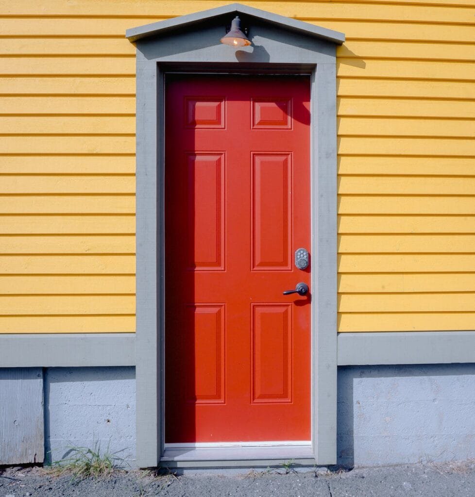 closed red wooden door to tenant portal tampa