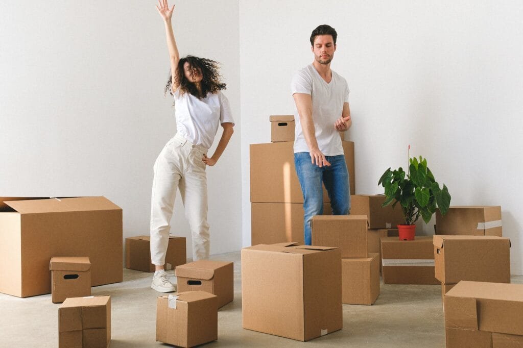 joyful young couple dancing after tenant turnover process