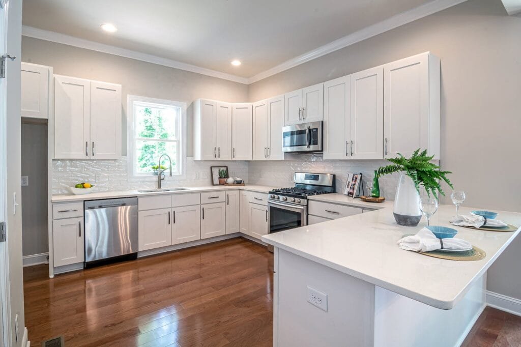 photo of white kitchen deciding to sell or rent your home